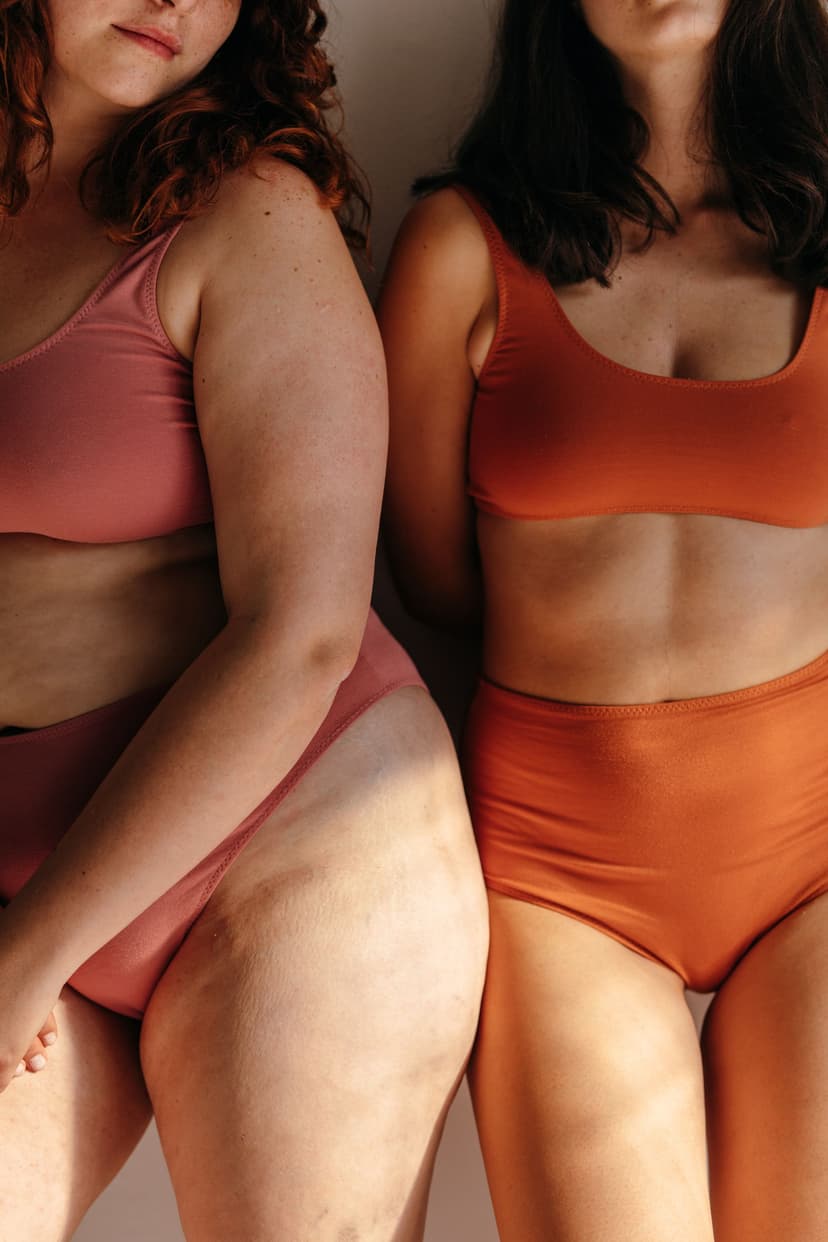 two women standing in underwear