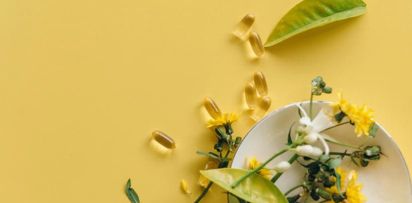 scattered herbs, flowers, and supplements